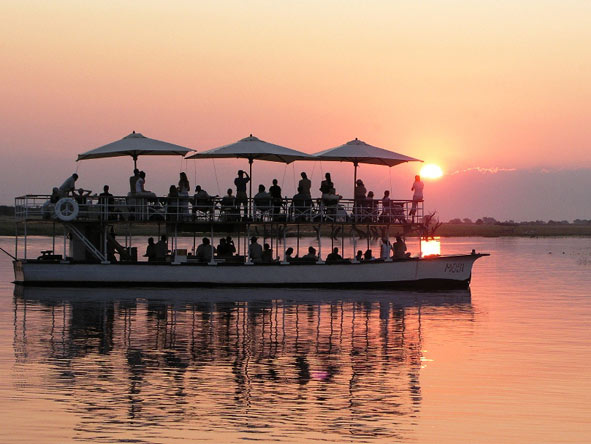 End the day with a Desert & Delta sunset cruise on the Chobe River - pure African magic.