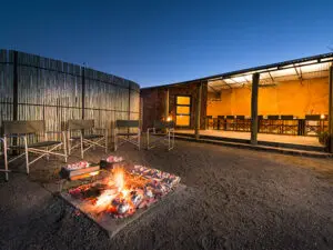 Relax with a pre-dinner drink & post-game drive conversation in the lodge's open-air Boma.