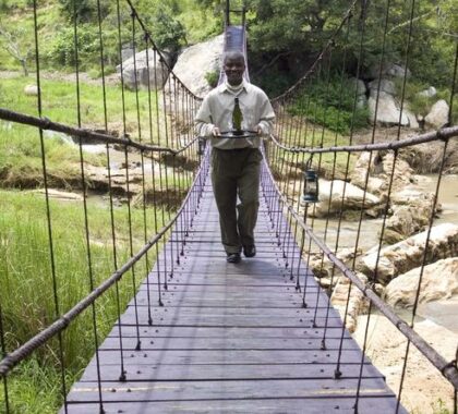 The lodge is connected through a wooden hanging bridge