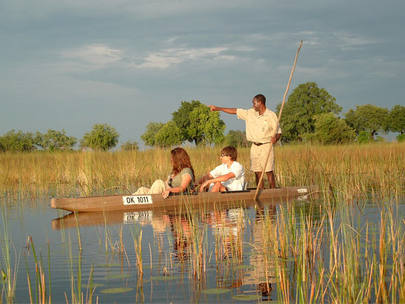 Exploring wild wetlands by canoe is part of the experience at Desert & Delta's Okavango camps.
