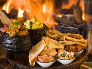 La comida malaya de Sudáfrica, picante y especiada, se disfruta mejor en invierno y se sirve delante de una chimenea de leña.