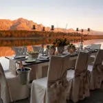 Combine buena comida con bellos paisajes en los viñedos de Cape Winelands.