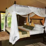 Four-poster beds are romantically draped and each tent has lovely private views from the roll-up tent sides.

