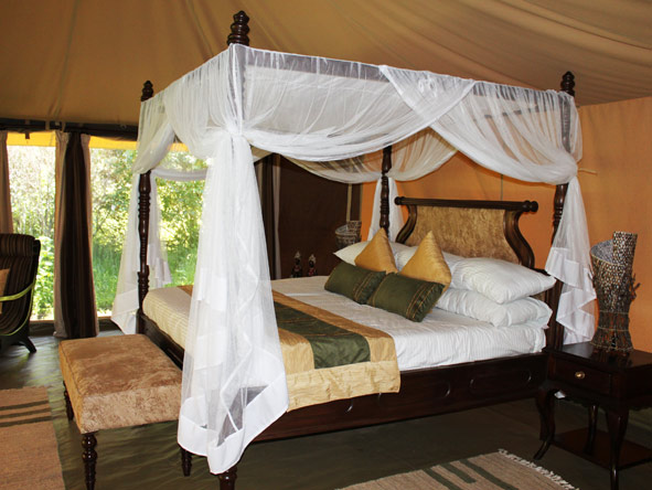 Four-poster beds are romantically draped and each tent has lovely private views from the roll-up tent sides.
