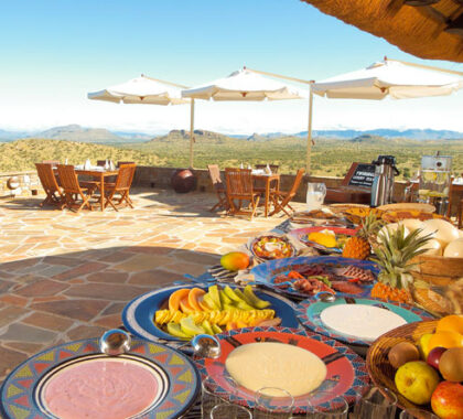 Breakfast on the terrace is served Namibian-style - with plenty of sunshine & big views.
