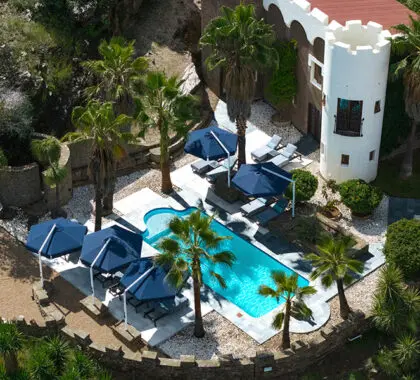 Have a swim in the pool which is heated in winter and nestled in the established gardens.