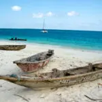 Take a walk along the squeaky soft sand, past wooden dhows & local fishermen mending their nets.