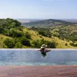 Overlooking the view from the pool | Singita Sasakwa Lodge