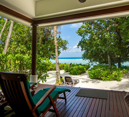 Relax on the deck of your beachfront villa.