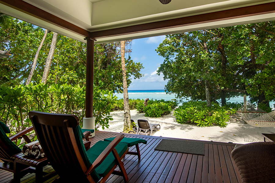 Relax on the deck of your beachfront villa.