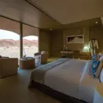 Wake up & watch the desert slip from one colour to another from the vantage of your bed.