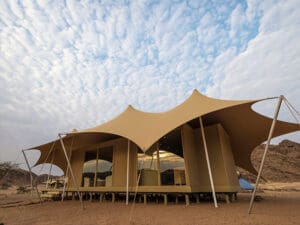 The camp's tented suites are a masterclass in innovative design & artistic appeal.