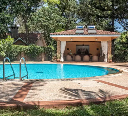 The pool pavillion with a view of the Poolside Cottage. 