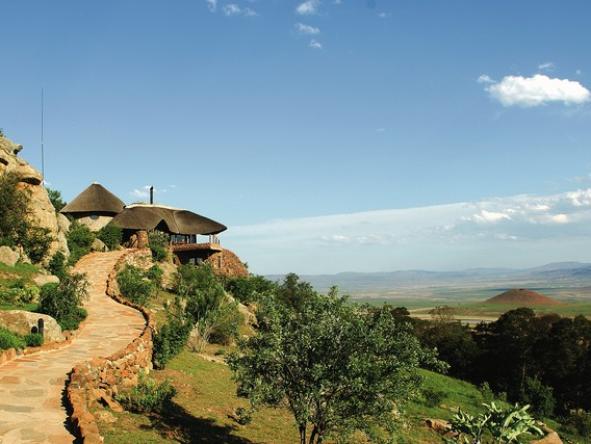 The lodge is located on a slope of a hill, overlooking the savannah.