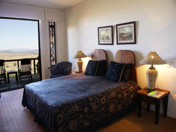 The spacious bedroom opens up unto a private balcony.