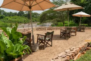 Relax under the shade of an umbrella next to the river.