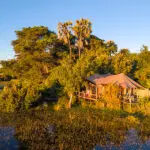Jacana Camp's suites overlook the water channels and Okavango Delta plains.