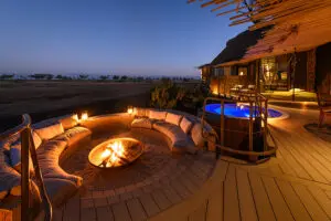 Enjoy pre-dinner drinks around the firepit at the Jao Villa. 