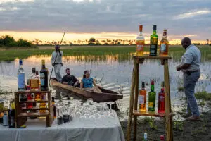 A classic Botswana sunset sundowner stop on a classic Botswana mokoro safari.