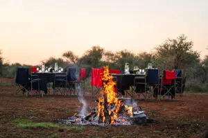Sundowners around a fire.