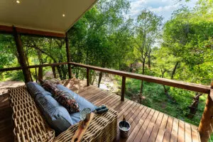 Nare Villa's upstairs room has a balcony overlooking the reserve. 