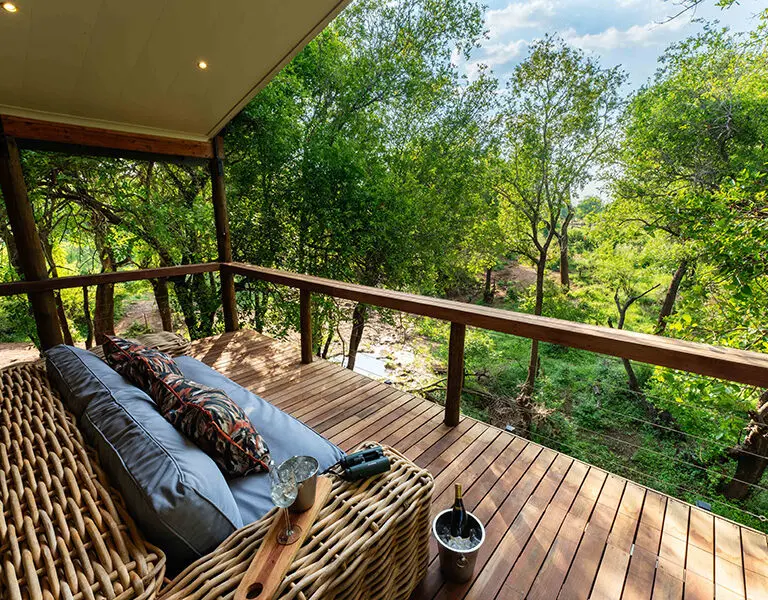 Nare Villa's upstairs room has a balcony overlooking the reserve. 