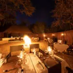 Enjoy a boma dinner outdoors around a roaring fire.