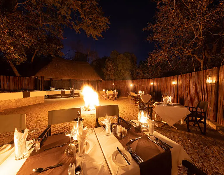 Enjoy a boma dinner outdoors around a roaring fire.