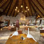 Meals are served in an open-air setting or in the indoor dining area.