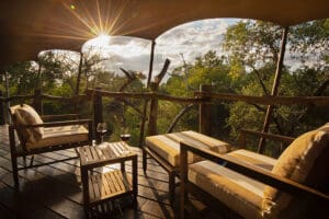 Take in the views from the deck of your luxury tent. 