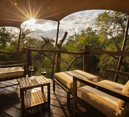 Take in the views from the deck of your luxury tent. 