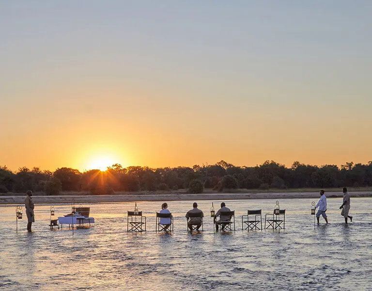 Sip on sundowners in the South Luangwa National Park.