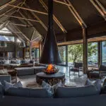 The beautifully designed main lodge with a central fireplace.