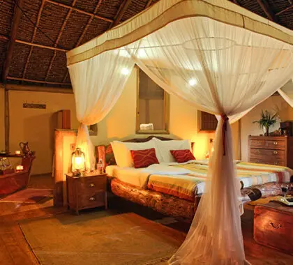 Draped mosquito nets, thatched roofs & antique furnishings create a classic safari feel at our selected accommodation.