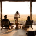 Relax on the lodge deck with a steaming cup of coffee and a view | Lewanika Lodge