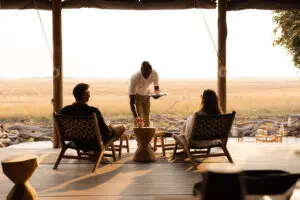 Relax on the lodge deck with a steaming cup of coffee and a view | Lewanika Lodge