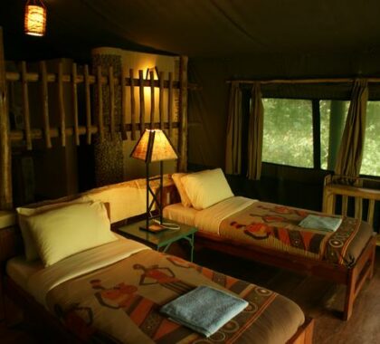 The rustic tented suites are furnished in a classic African style.

