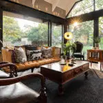 The lounge has large floor to ceiling windows to maximise views of the bush.