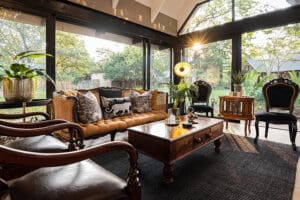 The lounge has large floor to ceiling windows to maximise views of the bush. 