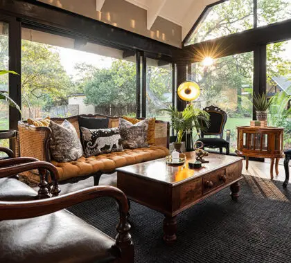 The lounge has large floor to ceiling windows to maximise views of the bush. 