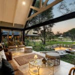 The bar and lounge verandah overlooks the firepit and waterhole beyond.