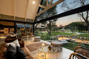 The bar and lounge verandah overlooks the firepit and waterhole beyond. 