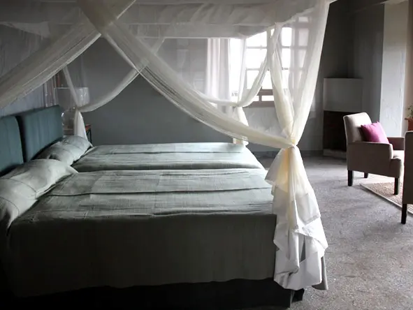 Mosquito nets cover the beds to add a wonderful romantic atmospheric touch.