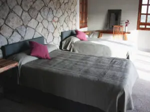 The cotttages are simply designed with the added touches of a fan, mosquito net, and a cosy fireplace.
