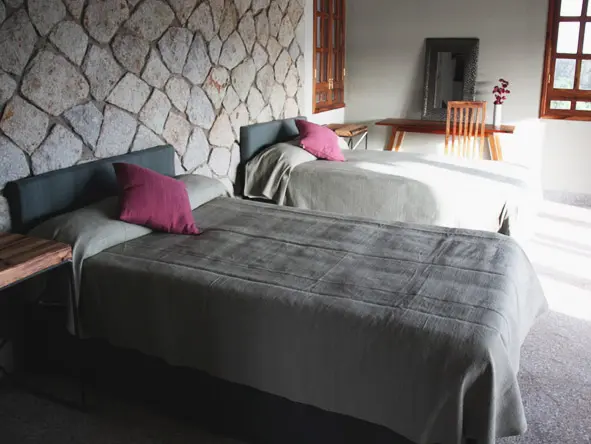 The cotttages are simply designed with the added touches of a fan, mosquito net, and a cosy fireplace.