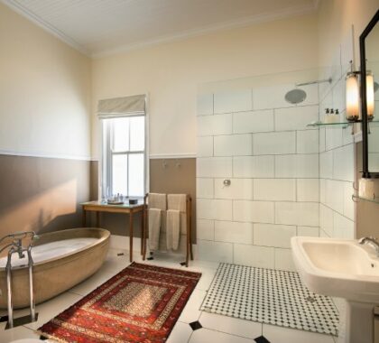 The suites at Uplands Homestead have private bathrooms that combine modern comfort with vintage luxury.