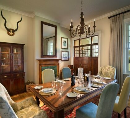 The refined dining areas at Uplands Homestead are highlighted by wooden floors, high ceilings and cosy fireplaces.