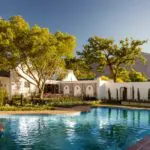 Spend the day lazing under dappled shade at the swimming pool.
