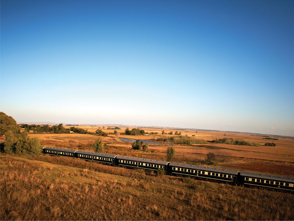 The best part of the train trip is simply sitting back & watching Africa roll past you.