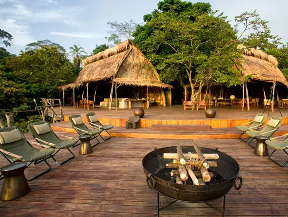 As evening falls, sit back in a comfortable chair & swop jungle stories around the campfire.